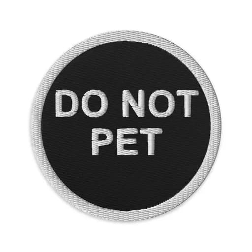 The round embroidered patch: DO NOT PET in white on black