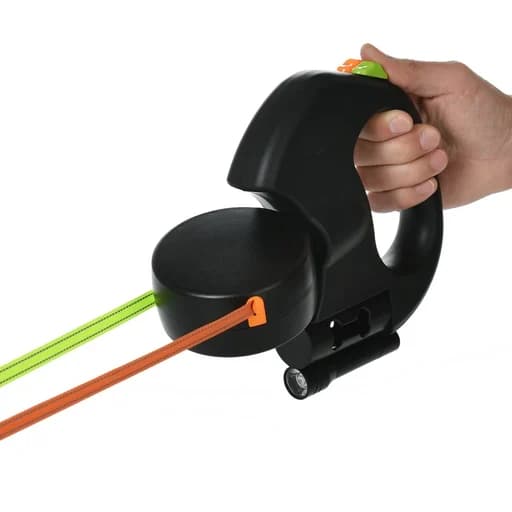 The double leash in a hand: lock buttons on top, the reel, two leads, the flashlight and the bag holder